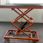 Table, cylinder and wheeled base