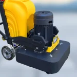 Lower head cover with adjacent motor and frame context — detail cropped from the source photograph, not another camera angle.