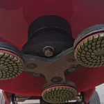 Underside with fitted round tools; tool specification is confirmed separately — detail cropped from the source photograph, not another camera angle.
