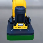 Lower head cover with adjacent motor and frame context — detail cropped from the source photograph, not another camera angle.