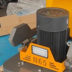 Motor housing and surrounding frame; this wider detail includes adjacent components — detail cropped from the source photograph, not another camera angle.