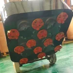 Underside with fitted tool carriers; attachment details require confirmation — detail cropped from the source photograph, not another camera angle.
