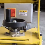 Height-adjustment handwheel and rear mounting plate — cropped from the source photograph.
