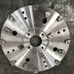 Round carrier with fitted segments; mounting compatibility is not implied