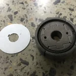 Clutch assembly beside a separate plate