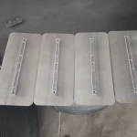 Four-blade set shown beside a pan