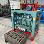Block machine beside freshly formed units