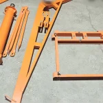 Disassembled crane frame and mast