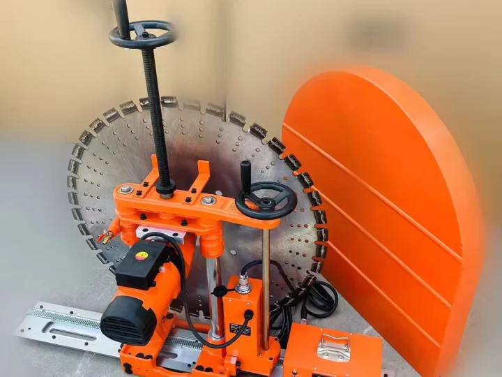 Rail-mounted wall-saw head and blade guard