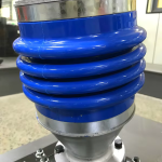 Blue bellows mounting example; confirm both fitting ends before ordering.