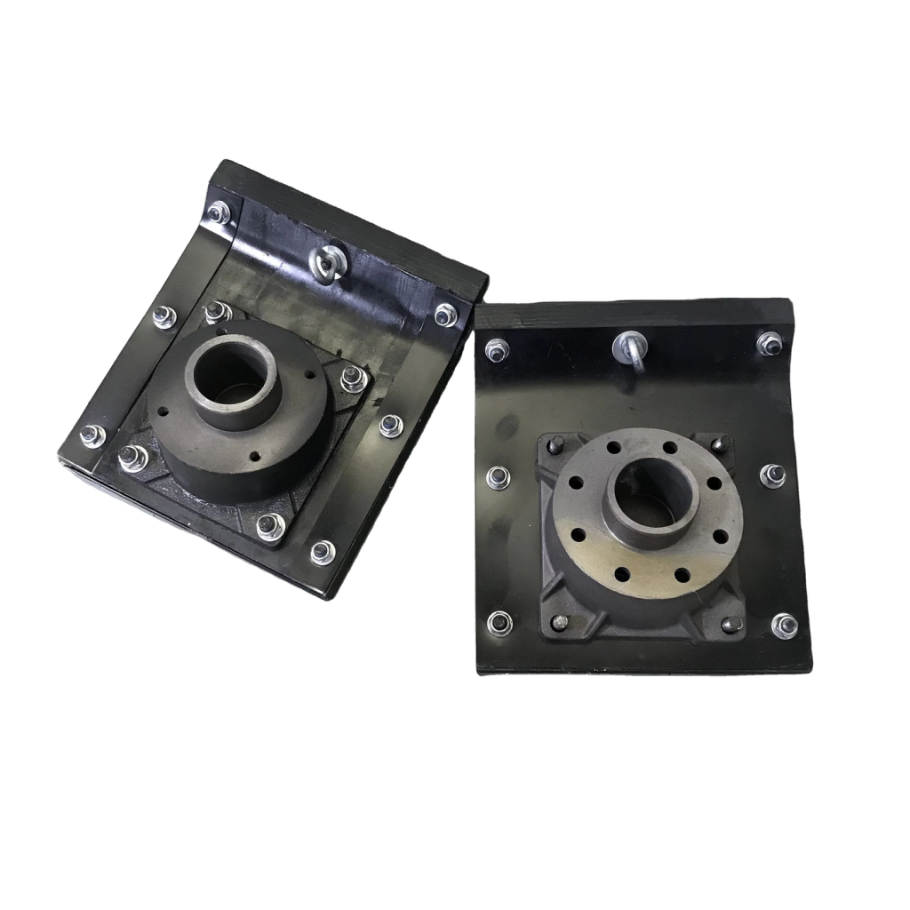 Two rectangular rammer shoes with central mounting flanges on white