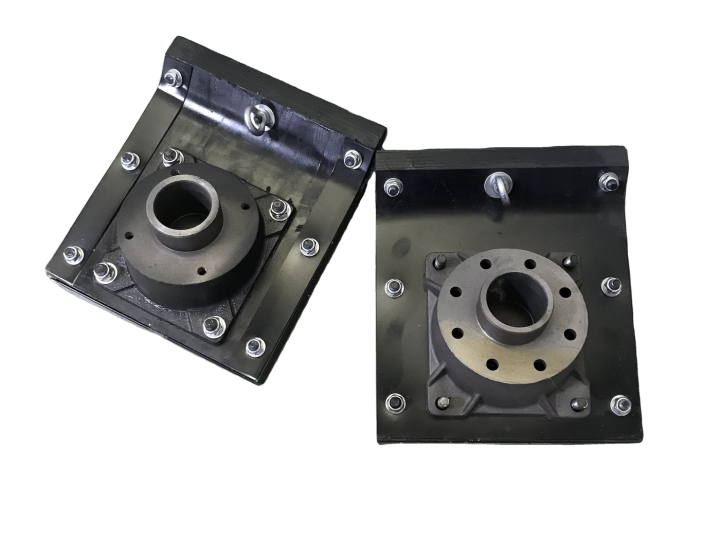 Two rectangular rammer shoes with central mounting flanges on white