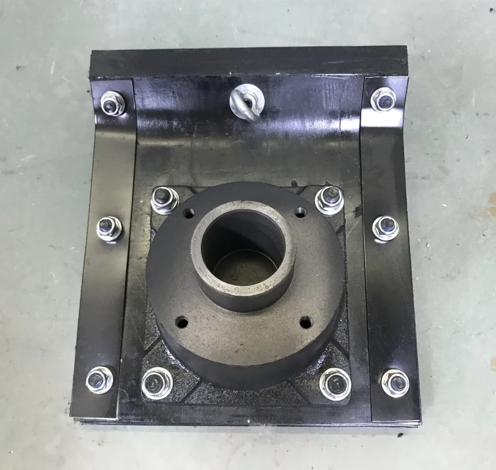 Close top view of a rammer shoe mounting opening and bolt positions