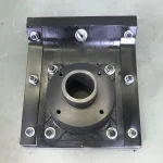 Close top view of a rammer shoe mounting opening and bolt positions