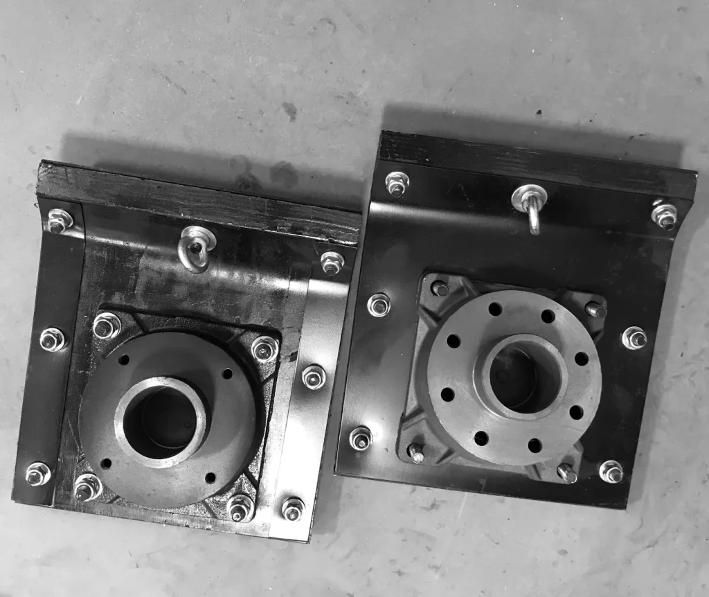 Two rammer shoe assemblies viewed from above