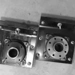 Two rammer shoe assemblies viewed from above