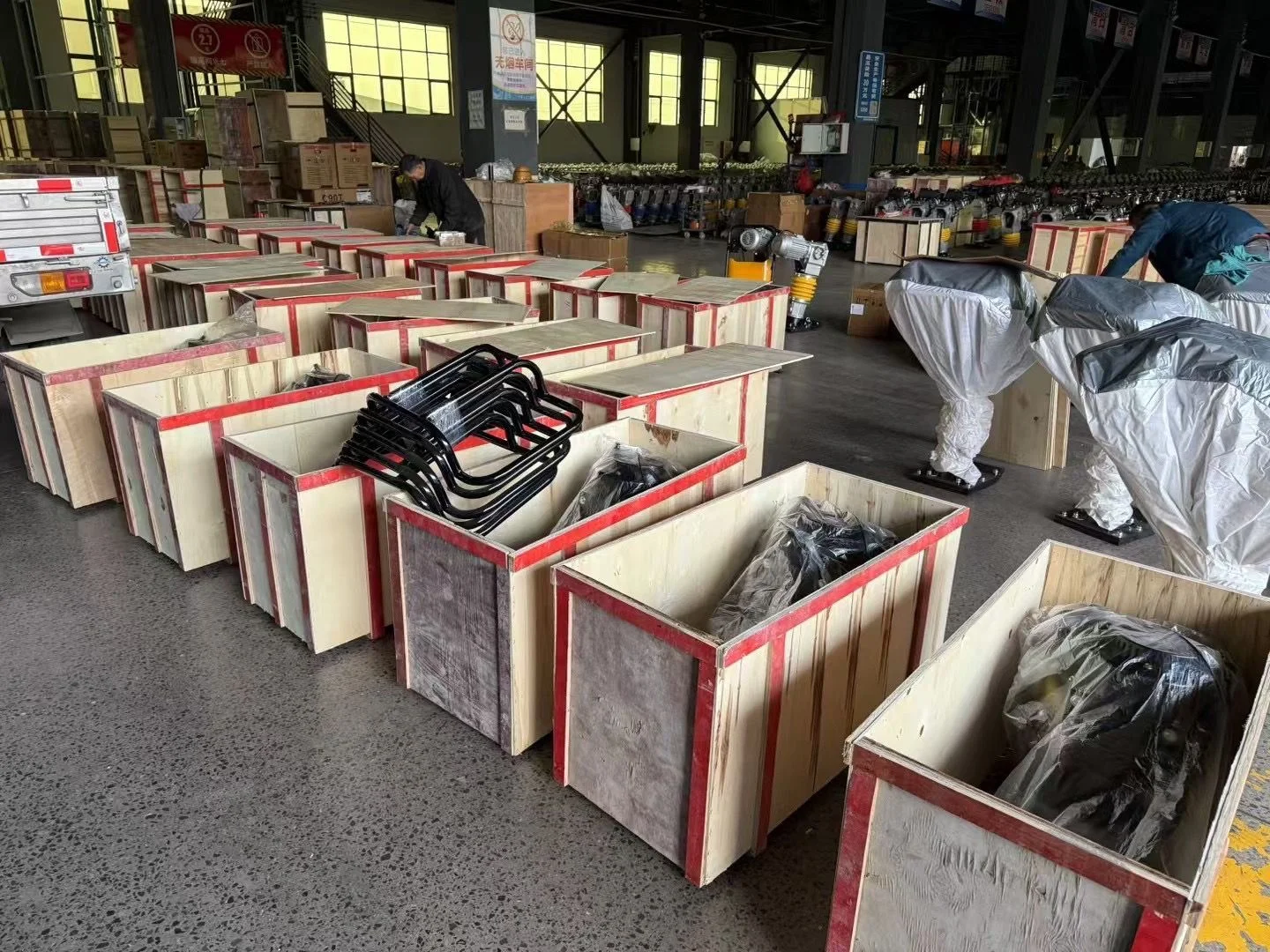 Wooden crates and machines in the packing area.