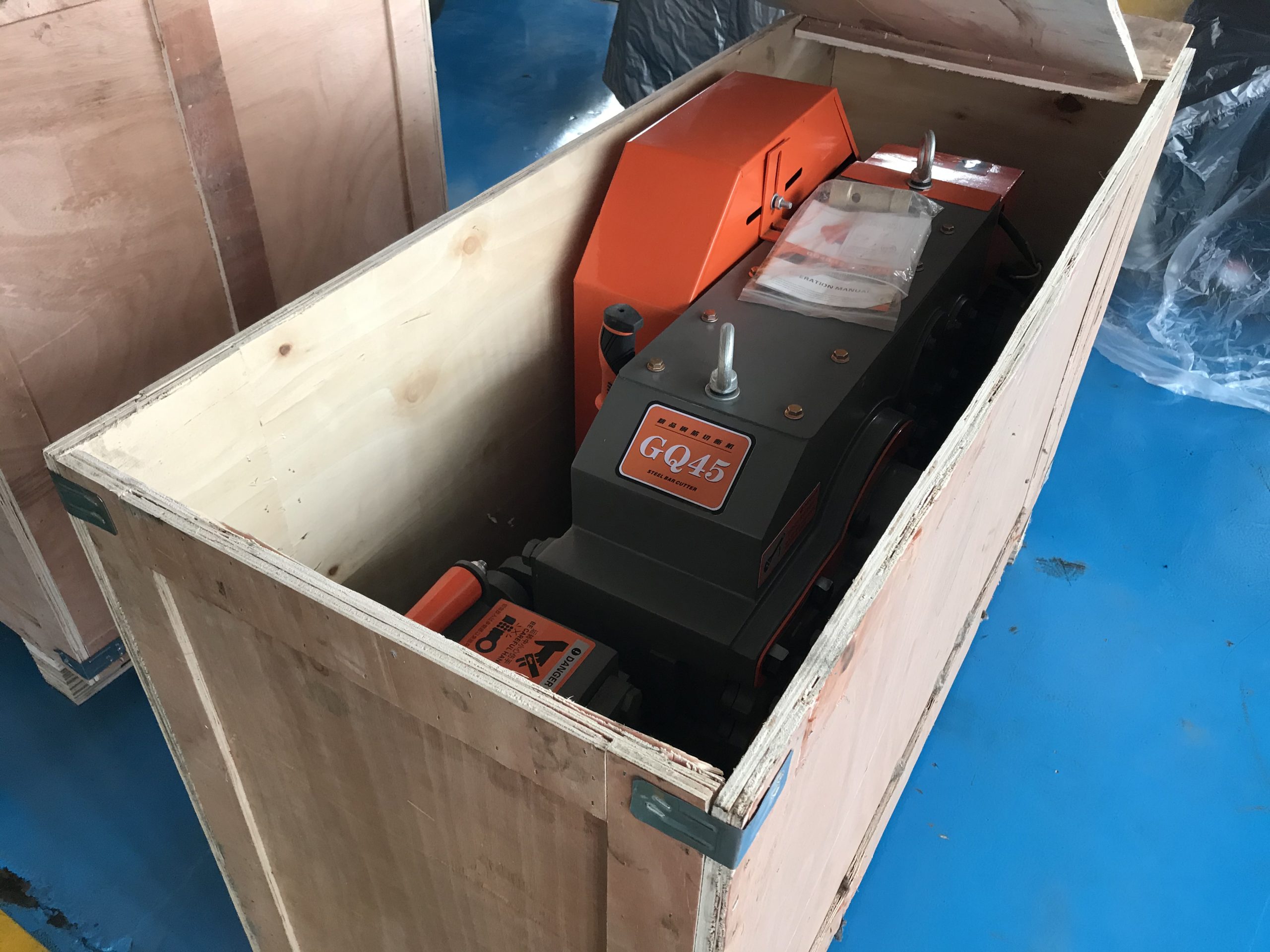 Rebar cutting machine inside a wooden shipping crate