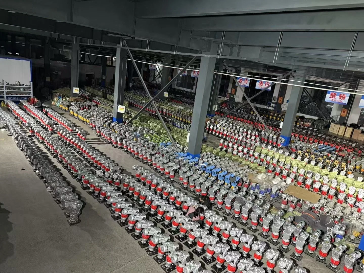A workshop view: tamping rammers arranged in batches.